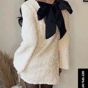 Elegant Cream Dress with Black Bow
